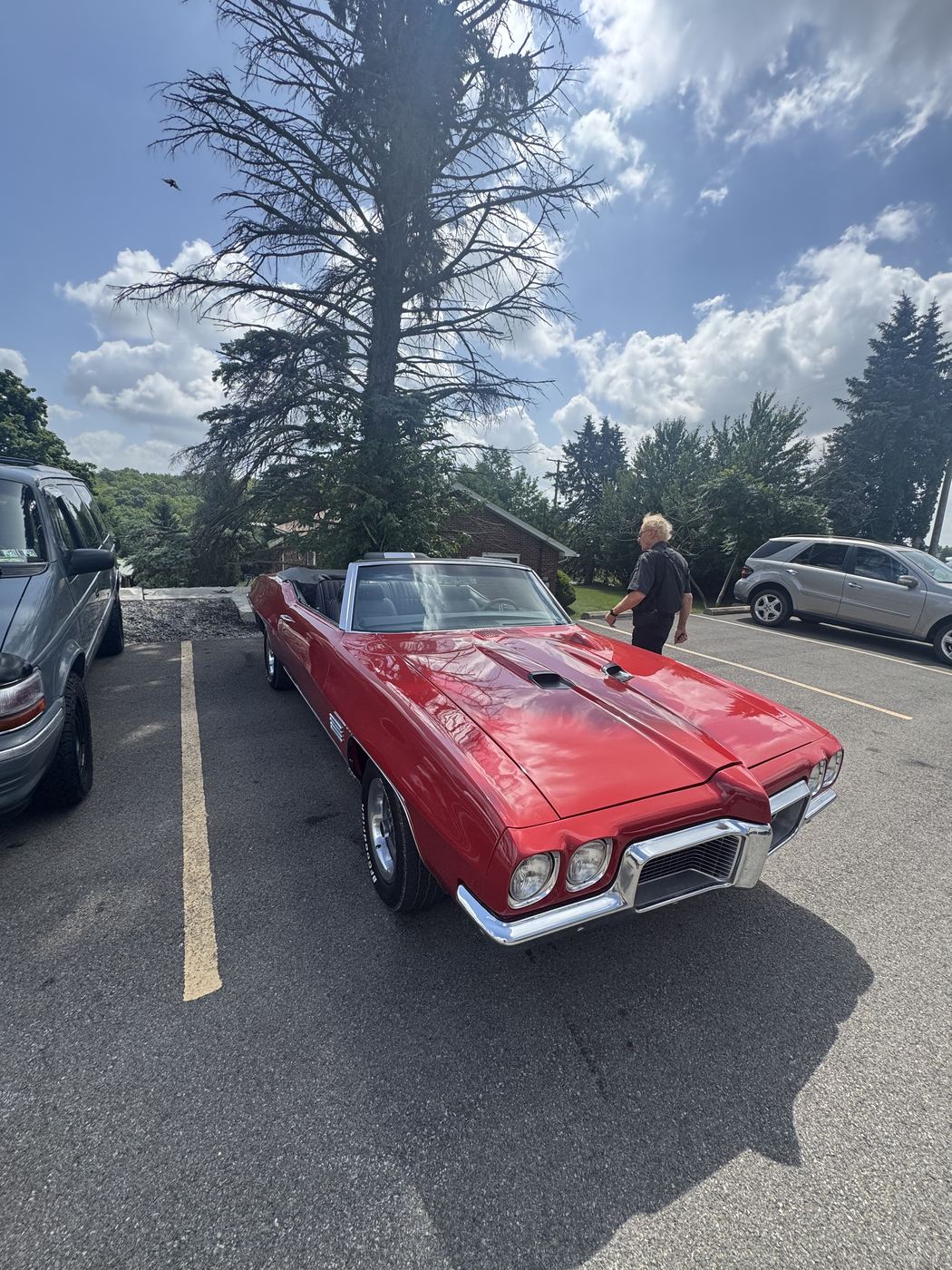 Red classic Pontiac convertible after full detail